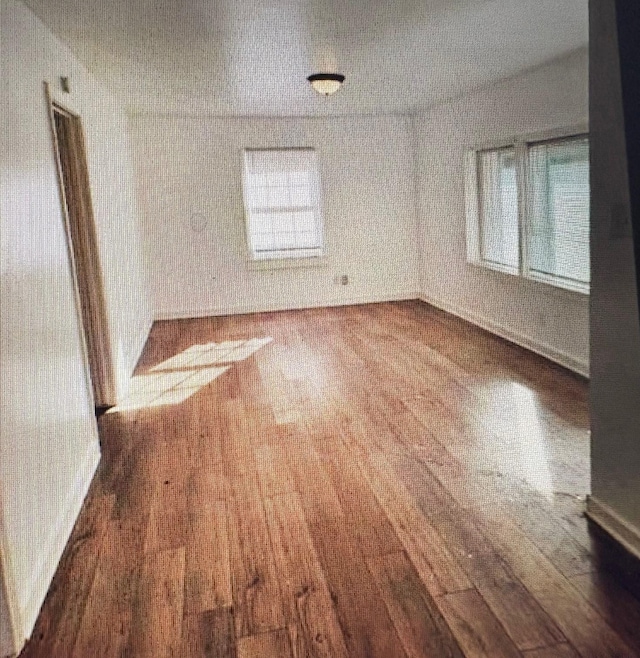 7005 Kassarine Pass, Houston, TX 77033 - unfurnished room with wood finished floors