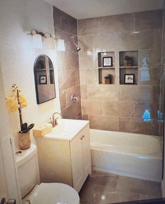 7005 Kassarine Pass, Houston, TX 77033 - bathroom featuring bathing tub / shower combination, vanity, and tile walls