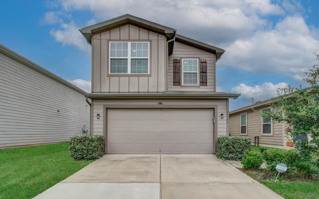 14746 Jasper Stream Ct, Houston, TX 77069 - view of front facade featuring board and batten siding, an attached garage, concrete driveway, and a front lawn