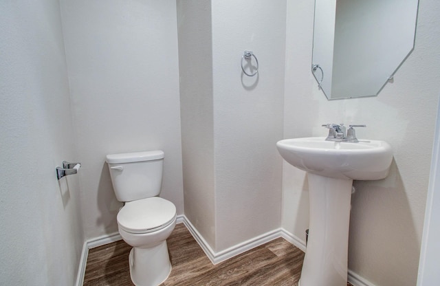 14746 Jasper Stream Ct, Houston, TX 77069 - half bath with toilet and wood finished floors