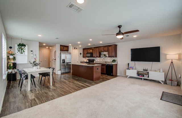 14746 Jasper Stream Ct, Houston, TX 77069 - kitchen featuring black appliances, a kitchen island, dark wood-style floors, a ceiling fan, and recessed lighting