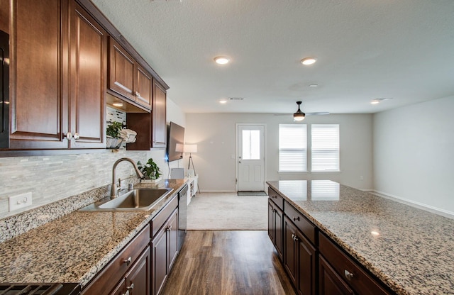 14746 Jasper Stream Ct, Houston, TX 77069 - kitchen featuring a ceiling fan, decorative backsplash, light stone counters, dark wood-style floors, and recessed lighting