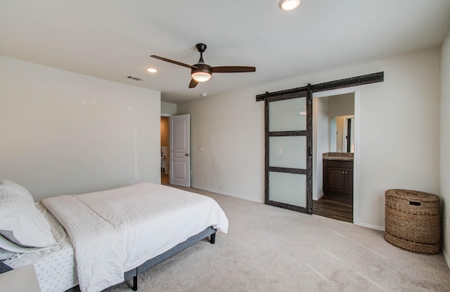 14746 Jasper Stream Ct, Houston, TX 77069 - bedroom with a barn door, light carpet, recessed lighting, a ceiling fan, and ensuite bath
