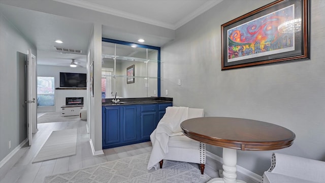 2608 Bering Dr Unit 2608, Houston, TX 77057 - full bath featuring crown molding, ceiling fan, vanity, a glass covered fireplace, and recessed lighting