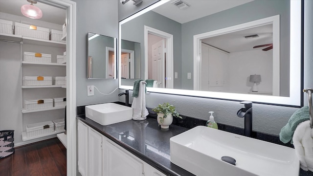 2608 Bering Dr Unit 2608, Houston, TX 77057 - bathroom with double vanity, wood finished floors, and ceiling fan