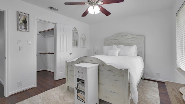 2608 Bering Dr Unit 2608, Houston, TX 77057 - bedroom featuring wood finished floors, a closet, a walk in closet, and ceiling fan