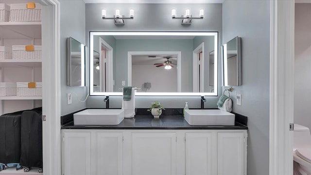 2608 Bering Dr Unit 2608, Houston, TX 77057 - full bathroom featuring double vanity and ceiling fan