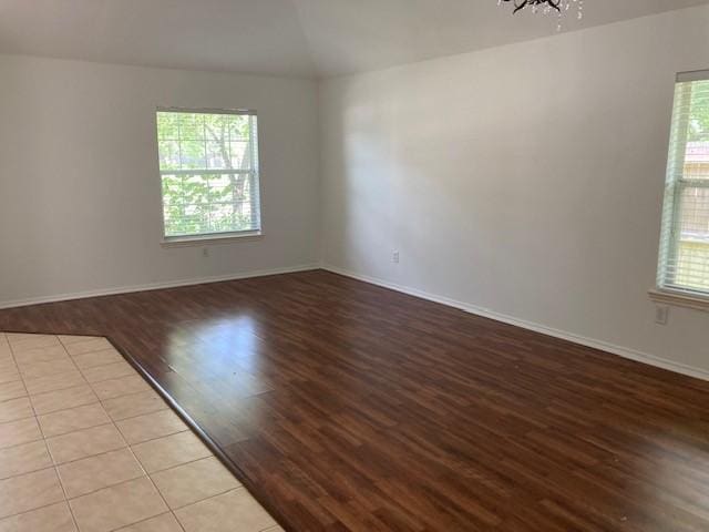 14007 Blackfoot Trail Run, Cypress, TX 77429 - spare room with wood finished floors, lofted ceiling, and a chandelier