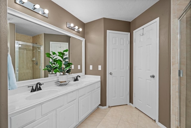 14007 Blackfoot Trail Run, Cypress, TX 77429 - bathroom with a stall shower, double vanity, tile patterned flooring, and a textured ceiling
