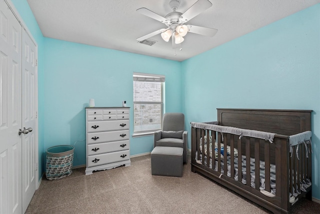 14007 Blackfoot Trail Run, Cypress, TX 77429 - carpeted bedroom featuring a closet, a ceiling fan, and a crib