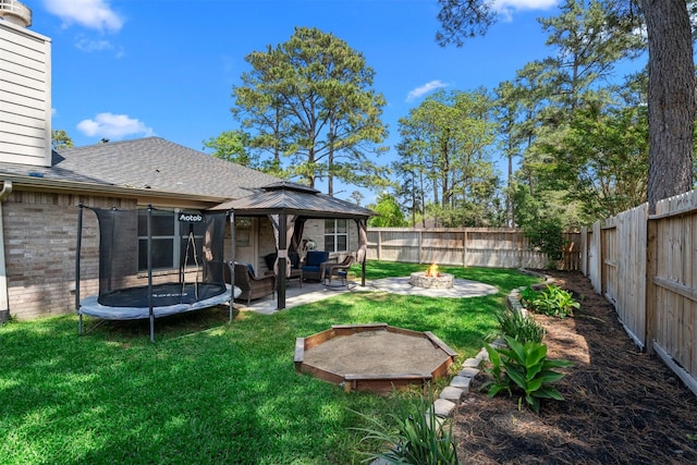 14007 Blackfoot Trail Run, Cypress, TX 77429 - fenced backyard with a trampoline, a gazebo, a patio, and an outdoor living space with a fire pit