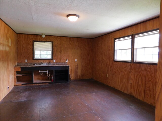 415 E Sherwood Dr, Livingston, TX 77351 - empty room featuring wood walls and a textured ceiling