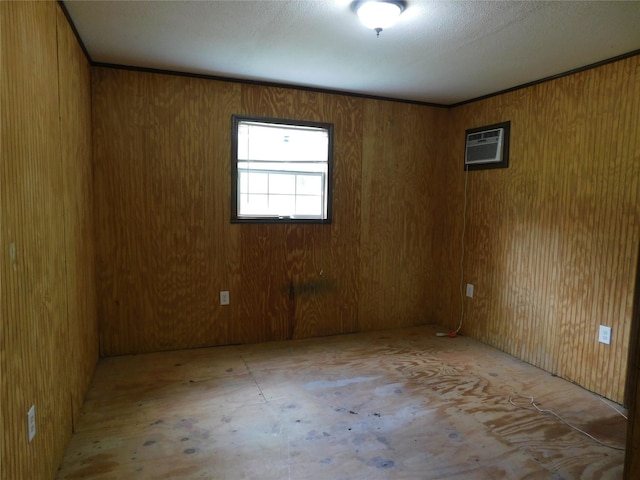415 E Sherwood Dr, Livingston, TX 77351 - empty room with a wall mounted AC and wooden walls