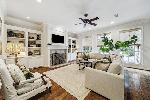 3827 Marquette St, West University Place, TX 77005 - living area featuring plenty of natural light, a ceiling fan, a fireplace, crown molding, and wood finished floors
