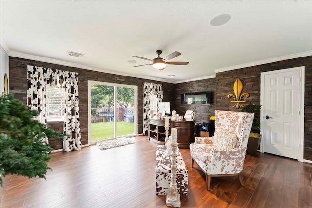 8002 Laguna Springs Ct, Houston, TX 77095 - living area featuring a ceiling fan, wood finished floors, ornamental molding, and wooden walls