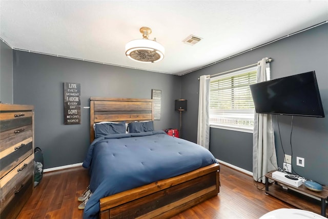 8002 Laguna Springs Ct, Houston, TX 77095 - bedroom with baseboards and wood finished floors
