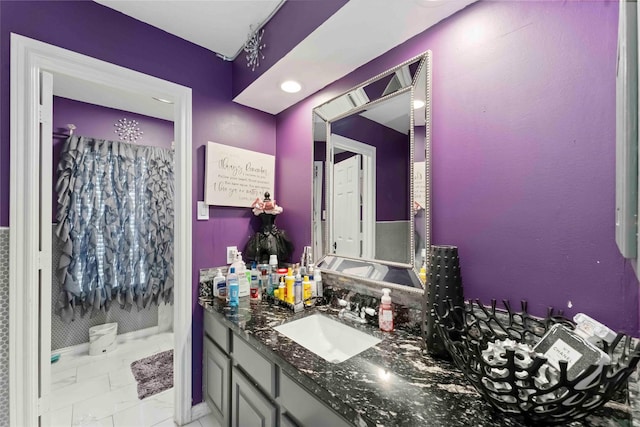8002 Laguna Springs Ct, Houston, TX 77095 - bathroom featuring marble look tiles and vanity