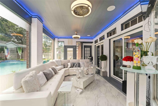 8002 Laguna Springs Ct, Houston, TX 77095 - sunroom with outdoor lounge area and marble look tile flooring
