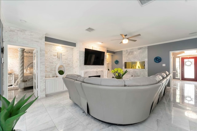 8002 Laguna Springs Ct, Houston, TX 77095 - living area with light marble finish flooring, ceiling fan, crown molding, and a fireplace