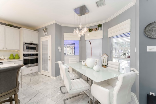 8002 Laguna Springs Ct, Houston, TX 77095 - dining room with a chandelier, crown molding, and light marble finish floors