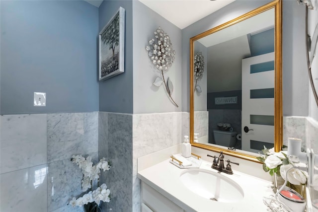 8002 Laguna Springs Ct, Houston, TX 77095 - bathroom with vanity, tile walls, and wainscoting