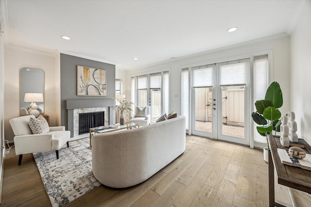 1228 Fountain View Dr Unit 180, Houston, TX 77057 - living area featuring ornamental molding, french doors, wood finished floors, a fireplace, and recessed lighting