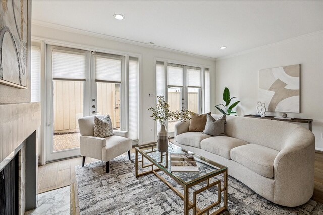 1228 Fountain View Dr Unit 180, Houston, TX 77057 - living area featuring crown molding, wood finished floors, and recessed lighting