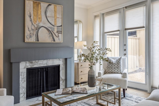 1228 Fountain View Dr Unit 180, Houston, TX 77057 - living area featuring ornamental molding, a high end fireplace, and wood finished floors