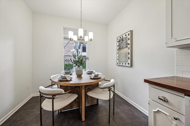 1228 Fountain View Dr Unit 180, Houston, TX 77057 - dining area with a chandelier and dark tile patterned floors