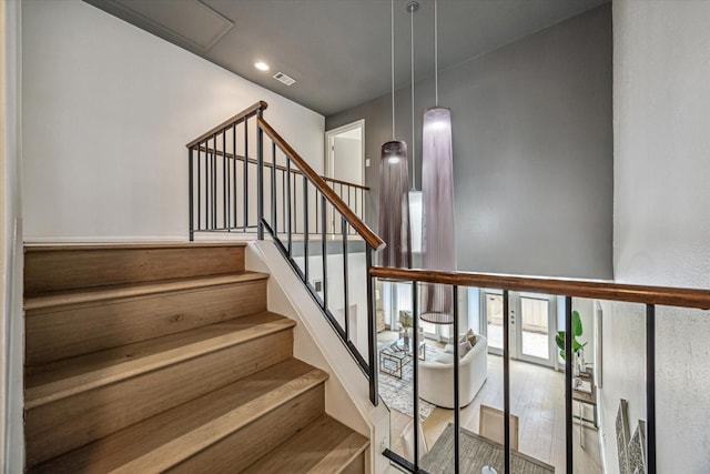 1228 Fountain View Dr Unit 180, Houston, TX 77057 - staircase featuring wood finished floors and recessed lighting