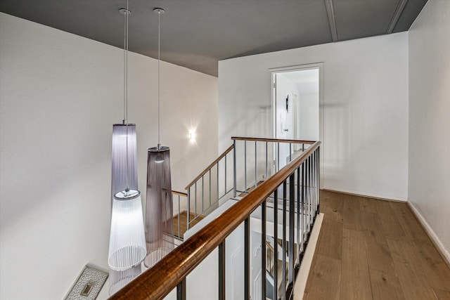 1228 Fountain View Dr Unit 180, Houston, TX 77057 - hall with wood finished floors and an upstairs landing