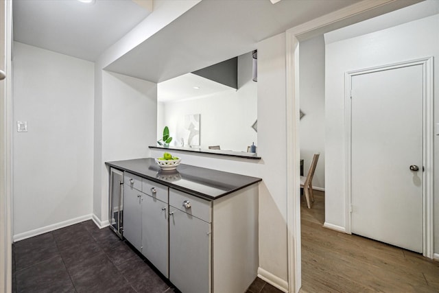 1228 Fountain View Dr Unit 180, Houston, TX 77057 - kitchen featuring dark countertops and baseboards