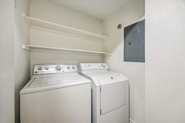 1228 Fountain View Dr Unit 180, Houston, TX 77057 - laundry area with electric panel and washer and clothes dryer