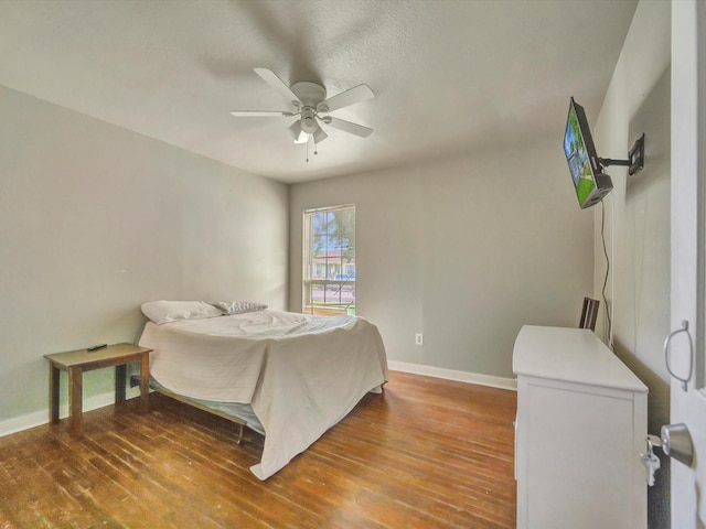 1214 W 6th St, Freeport, TX 77541 - bedroom with wood finished floors and a ceiling fan
