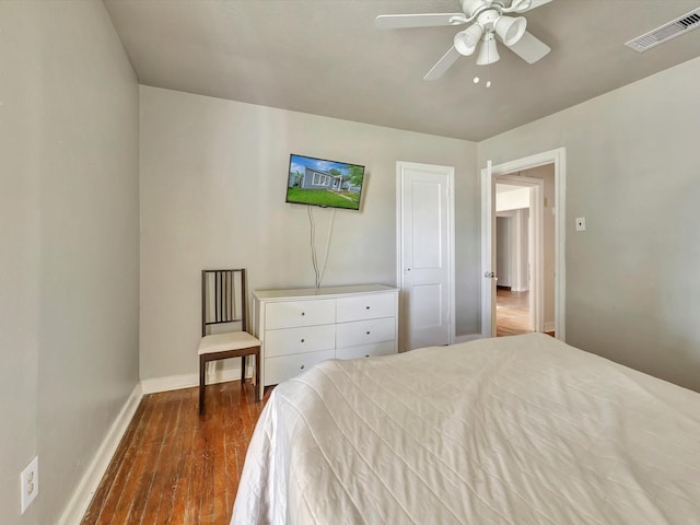 1214 W 6th St, Freeport, TX 77541 - bedroom with dark wood-type flooring and a ceiling fan