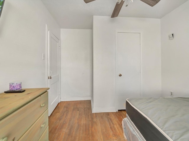 1214 W 6th St, Freeport, TX 77541 - bedroom with light wood-style floors and a ceiling fan