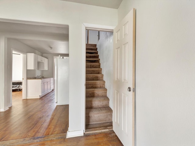 1214 W 6th St, Freeport, TX 77541 - stairway with wood finished floors and baseboards