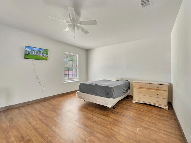 1214 W 6th St, Freeport, TX 77541 - bedroom featuring wood finished floors and a ceiling fan