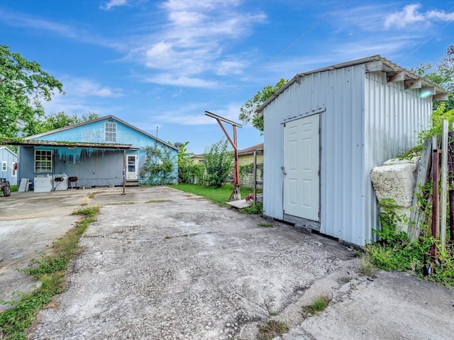 1214 W 6th St, Freeport, TX 77541 - view of shed with driveway