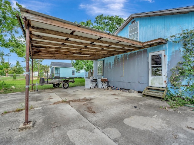 1214 W 6th St, Freeport, TX 77541 - view of car parking with entry steps and a carport