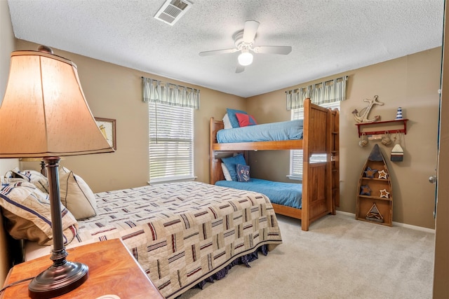 1831 Lakeview Estates Dr, Coldspring, TX 77331 - bedroom with carpet flooring, a textured ceiling, and ceiling fan