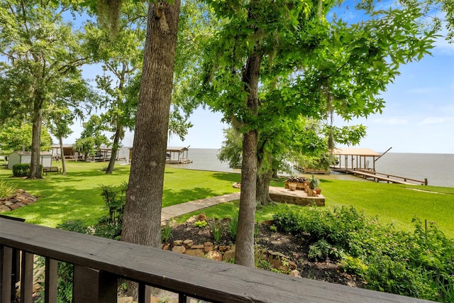 1831 Lakeview Estates Dr, Coldspring, TX 77331 - view of green lawn featuring a water view