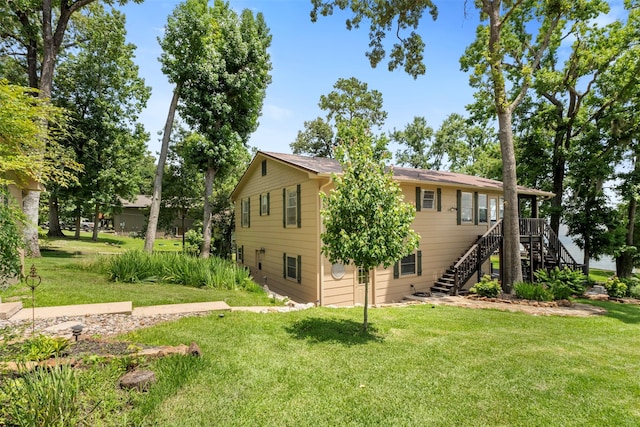 1831 Lakeview Estates Dr, Coldspring, TX 77331 - back of property with stairs and a yard