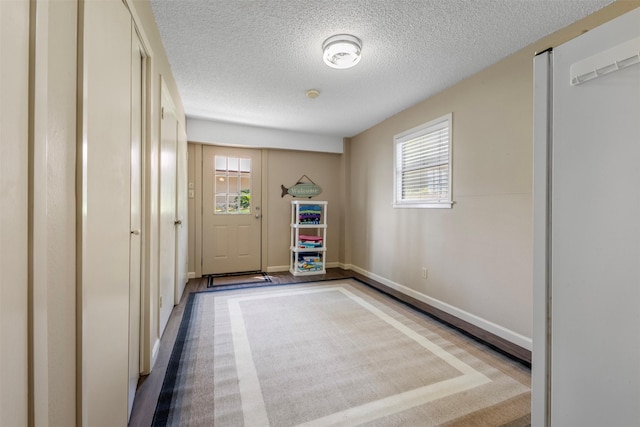 1831 Lakeview Estates Dr, Coldspring, TX 77331 - doorway to outside with plenty of natural light and a textured ceiling