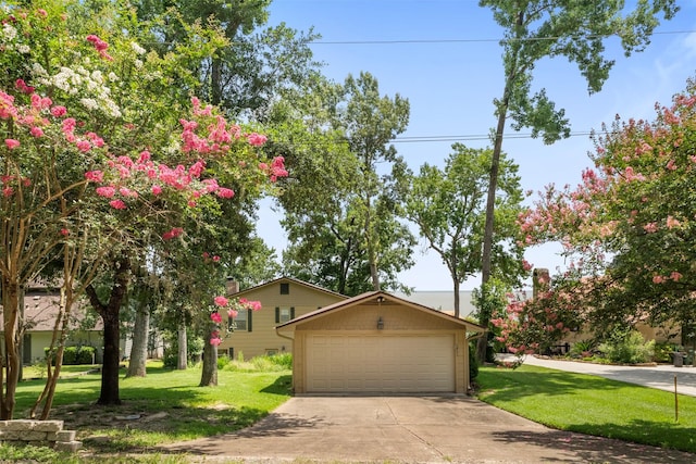 1831 Lakeview Estates Dr, Coldspring, TX 77331 - view of front of property featuring concrete driveway, a front lawn, and an attached garage