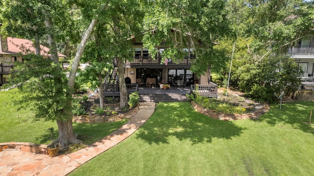 1831 Lakeview Estates Dr, Coldspring, TX 77331 - view of grassy yard featuring a deck and stairs