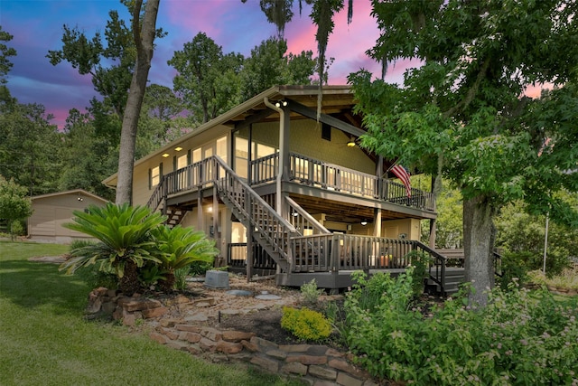 1831 Lakeview Estates Dr, Coldspring, TX 77331 - back of house with stairway, a wooden deck, and a yard