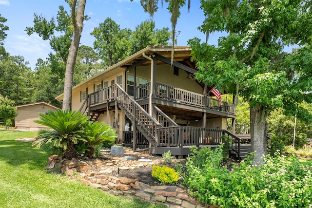 1831 Lakeview Estates Dr, Coldspring, TX 77331 - rear view of property featuring stairs, a deck, and a yard