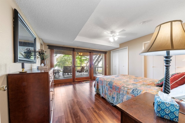 1831 Lakeview Estates Dr, Coldspring, TX 77331 - bedroom with access to outside, wood finished floors, a textured ceiling, and a closet