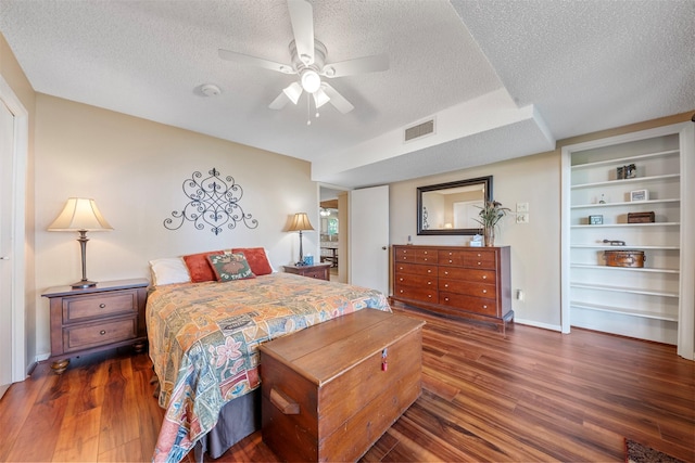 1831 Lakeview Estates Dr, Coldspring, TX 77331 - bedroom featuring a textured ceiling, wood finished floors, and ceiling fan